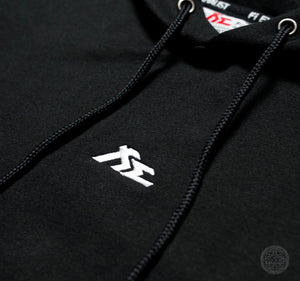 Fi EXHAUST white logo embroidered on a black hoodie's chest.
